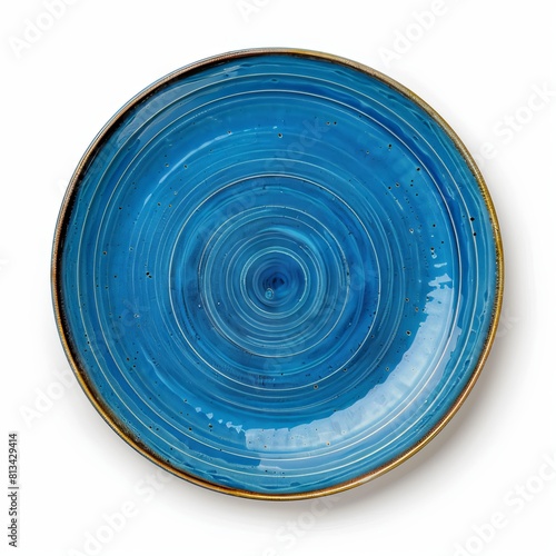 A top view of a set of circular ceramic plates with a blue dish isolated on a white background is shown.