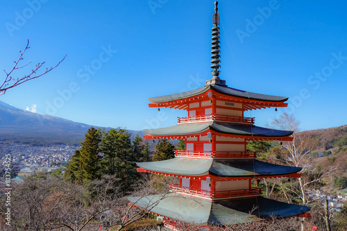 The iconic view of Mount Fuji with the red Chureito pagoda and Fujiyoshida city from Arakurayama sengen park in Yamanashi Prefecture, Japan.