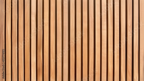 Wall made of wooden panels. Vertical wooden slats for facade cladding. Timber stripes made of beige pine. A modern plank surface for interior and exterior design.
