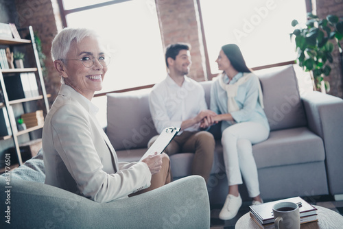 Photo of young couple appointment psychotherapist lady loft interior office indoors