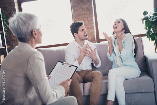 Photo of young outraged couple appointment psychotherapist loft interior office indoors