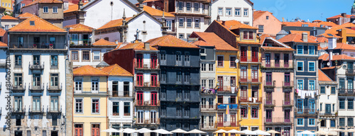 Panoramic view of UNESCO world heritage site Porto city in Portugal, colorful buildings during sunny day.