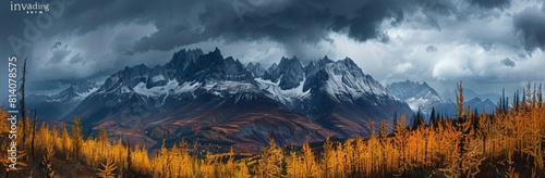 A panoramic view of the "invading storm" in Y Ross, British Columbia with dark clouds and yellow larch trees. A high-resolution photograph capturing every detail of these majestic mountains. 