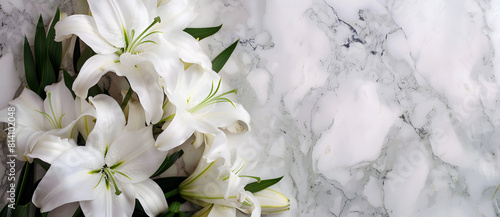 Beautiful lilies on a marble background as a bouquet at a cemetery, representing a funeral concept.