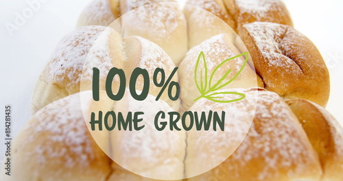 Image of 100 percent home grown text banner against close up of fresh bread on white background