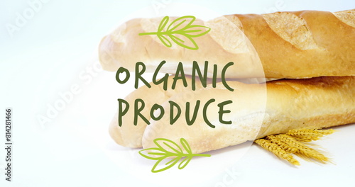 Image of organic produce text banner against close up of fresh bread and wheat ears