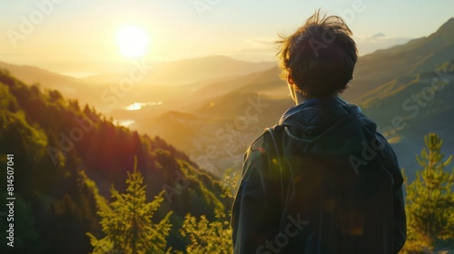 A solo traveler admiring a breathtaking mountain vista at sunrise, their face turned away or partially obscured by a camera, conveying the sense of awe and wonder inspired by nature's beauty.