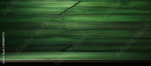 A fresh coat of green paint covers slanted or diagonal wooden planks creating a blank space for images. Copyspace image