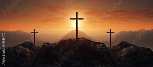 At sunrise there is a copy space image of three crosses being crucified on a hill