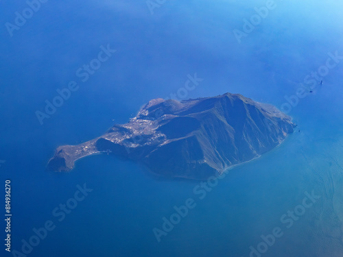 Filicudi island aerial view from airplane at sunset, Aeolian Islands, Sicily, Italy