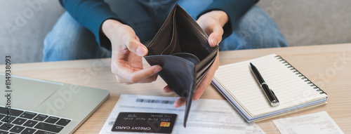 Debt financial concept, stressed problem asian woman hand open empty wallet, purse not have budget of money to pay no have credit card, not able payment bill, loan or expense with bank, bankruptcy.