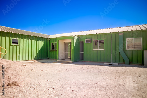 Green container modules combined to form offices at a mine