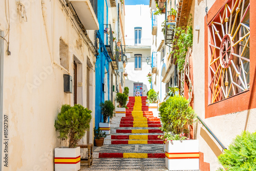 Stairs adorned with colors of Spanish flag, in Calpe old town. Alicante province, Valencian Community, Spain