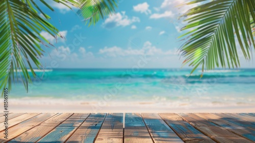A wooden deck on a sandy beach, surrounded by tall palm trees swaying in the breeze. The deck overlooks the clear blue ocean, with waves gently lapping at the shore