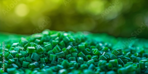 Green plastic granules. Polyethylene terephthalate (PET) biopolymer. Plastic for recycling.