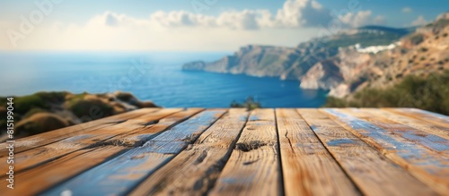 "Empty wooden table top with a blurred view of the stunning coastline of a picturesque Greek island, evoking a vacation vibe."