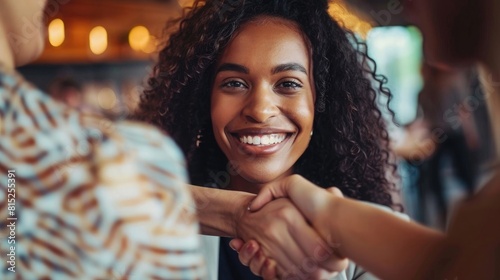 Close up african american businesswoman shaking hands with caucasian client. Women's shake hands as hello closeup. Friend welcome, introduction, greet or thanks gesture.