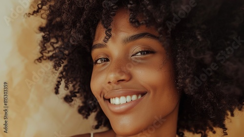 Natural curls framing a smiling face, embracing the beauty of textured hair. 