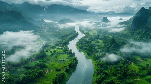 Aerial view of the Mekong River in Laos, winding through lush green valleys, traditional villages, and surrounded by misty mountains. 