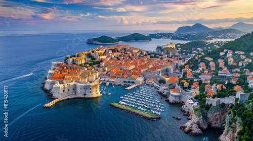 Aerial view of Dubrovnik in Croatia, with its well-preserved medieval walls and red-roofed buildings along the Adriatic Sea. 