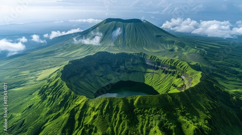 Aerial view of the Mount Aso in Japan, featuring its active volcanic crater, surrounding caldera, and lush green landscapes. 