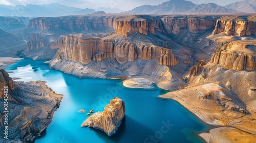 Aerial view of the Band-e Amir National Park in Afghanistan, showcasing its stunning blue lakes, surrounded by rugged mountains and unique rock formations. 