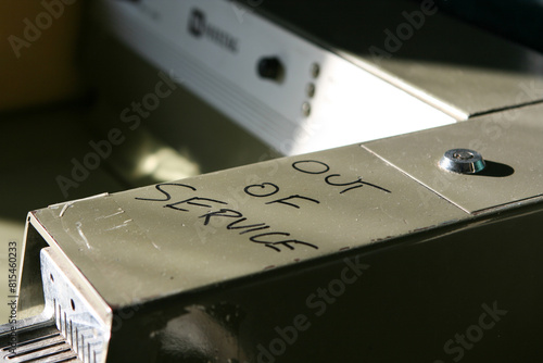 OUT OF SERVICE written on laundromat washing machine