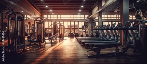 Interior of a fitness hall with equipment. Toned image.