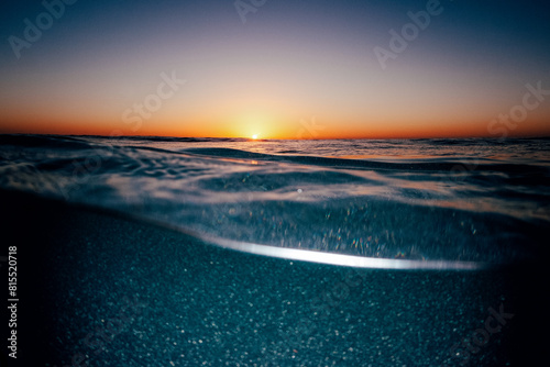 Split capture of an sun rising over a sparkling sea using a flash