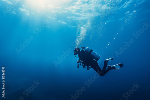 Scuba Diver Swimming in Deep Blue Ocean