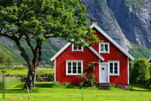 Isolated red house in the mountains, beautiful typical northern european house in secluded landscape