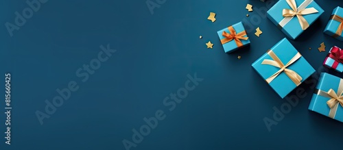 Flat lay composition with gift boxes on blue background space for text Greeting card. copy space available