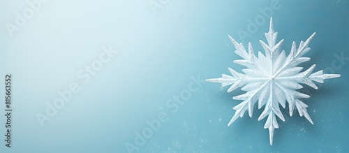 Christmas winter and new year background concept Top view of Christmas star and snowflake on pastel blue background. copy space available