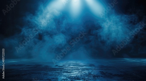 Blue mist and cracked ground. Dramatic smoke effect over dark surface.