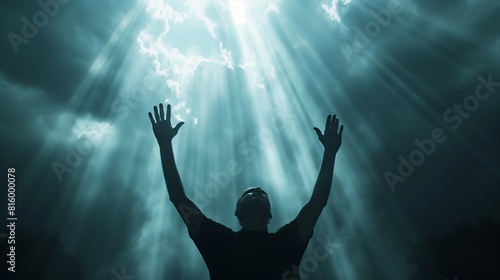 Man's Reverent Gesture Under Heavenly Glow