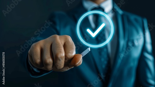 Businessperson pressing virtual button with check mark symbol, representing concept of approval, completion, or positive feedback in digital interaction.