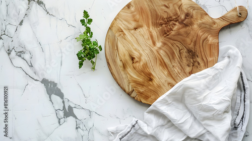 Wood cutting board with linen napkin and plant on marble table with copy space top view : Generative AI