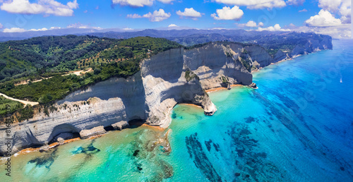 Ionian islands of Greece Corfu. Panoramic aerial view of stunning Cape Drastis - natural beuty landscape with white rocks and turquoise waters.