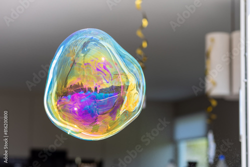 A colourful soap bubble floating in mid-air 