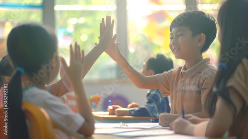 Pupil boy hi five with asian teacher in classroom at elementary school Student boy study in primary school Children writing notes in classroom Education knowledge successful teamwork c : Generative AI