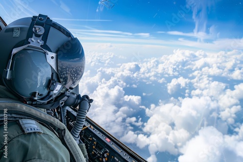 fighter jet pilot in cockpit soaring above the clouds photo