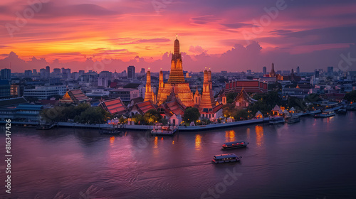 at Arun pagoda at sunset, captured from a riverside hotel overlooking the Chao Phraya River. A picturesque travel destination that encapsulates the essence of Thailand's capital city.
