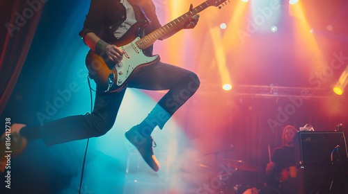 Singer with electric guitar jumping in moment on stage Vocalist performing with spotlights behind him Concept of Rocknroll music and dance festivals and concerts culture : Generative AI