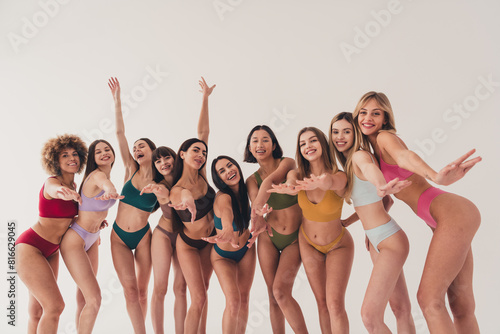 Photo of group ten women in lingerie keep you attention and would like touching isolated on white color background
