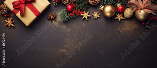 A festive Christmas scene with a golden gift box surrounded by red ribbons fir branches cones stars and Christmas cookies The top view image offers plenty of space for adding text or graphics