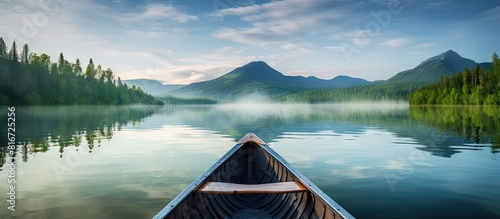 A serene morning on a canoe with a breathtaking backdrop and plenty of empty space for capturing stunning images. with copy space image. Place for adding text or design