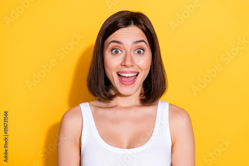 Photo portrait of attractive young girl excited face wear trendy white outfit isolated on yellow color background
