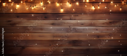 A vintage wooden background with illuminated lights perfect for Christmas decorations and plenty of space for your own images or text. with copy space image. Place for adding text or design