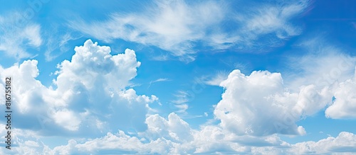 The vibrant summer sky with clouds presents a beautiful natural scene providing ample copy space for text addition