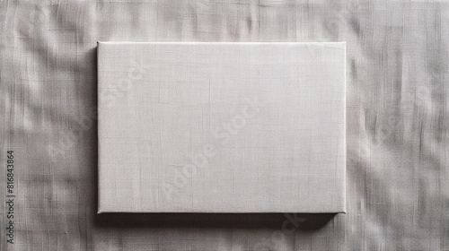 Canvas stretched over frame on plain linen background tightly toned